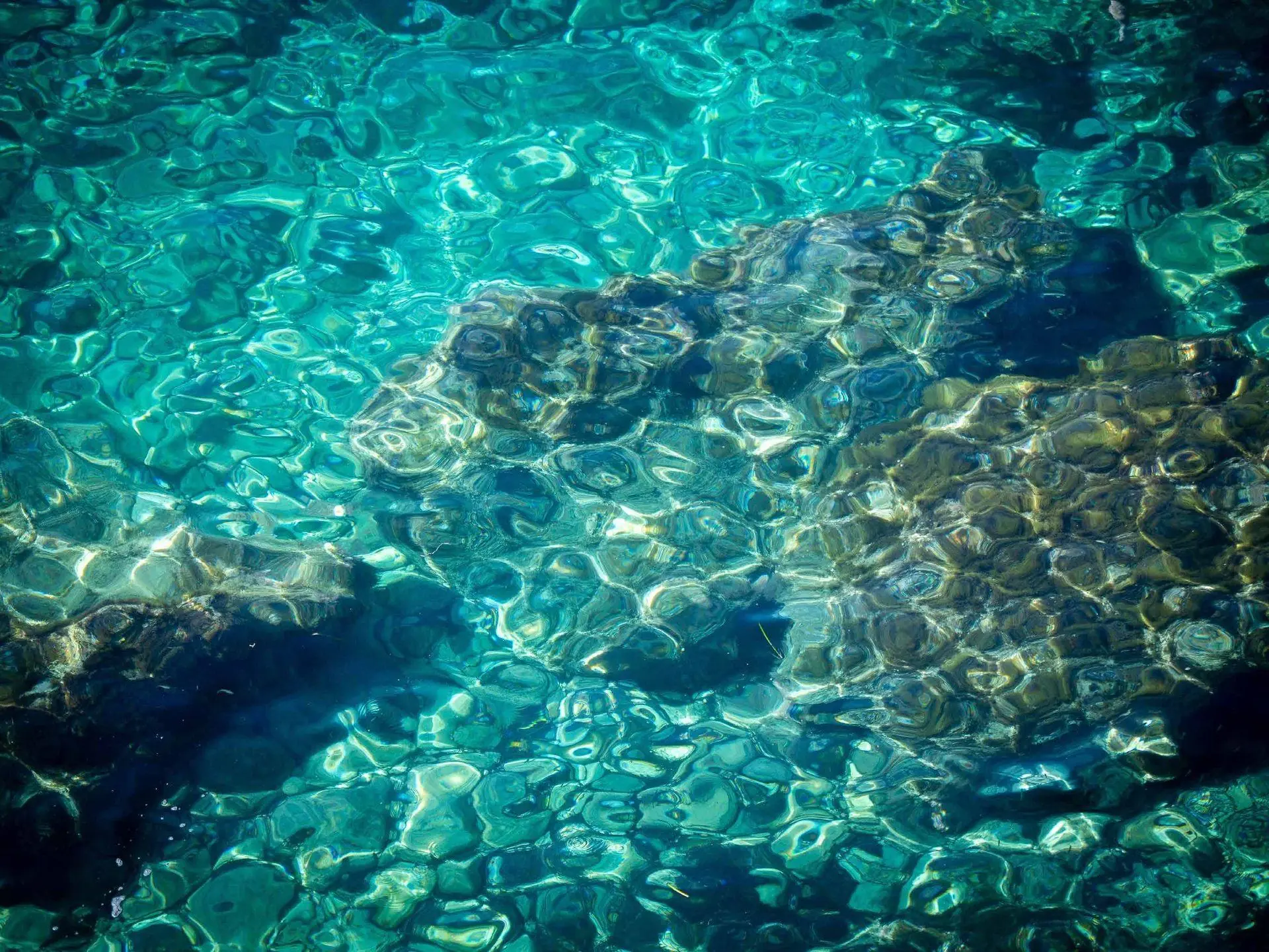 Clear turquoise water over rocks