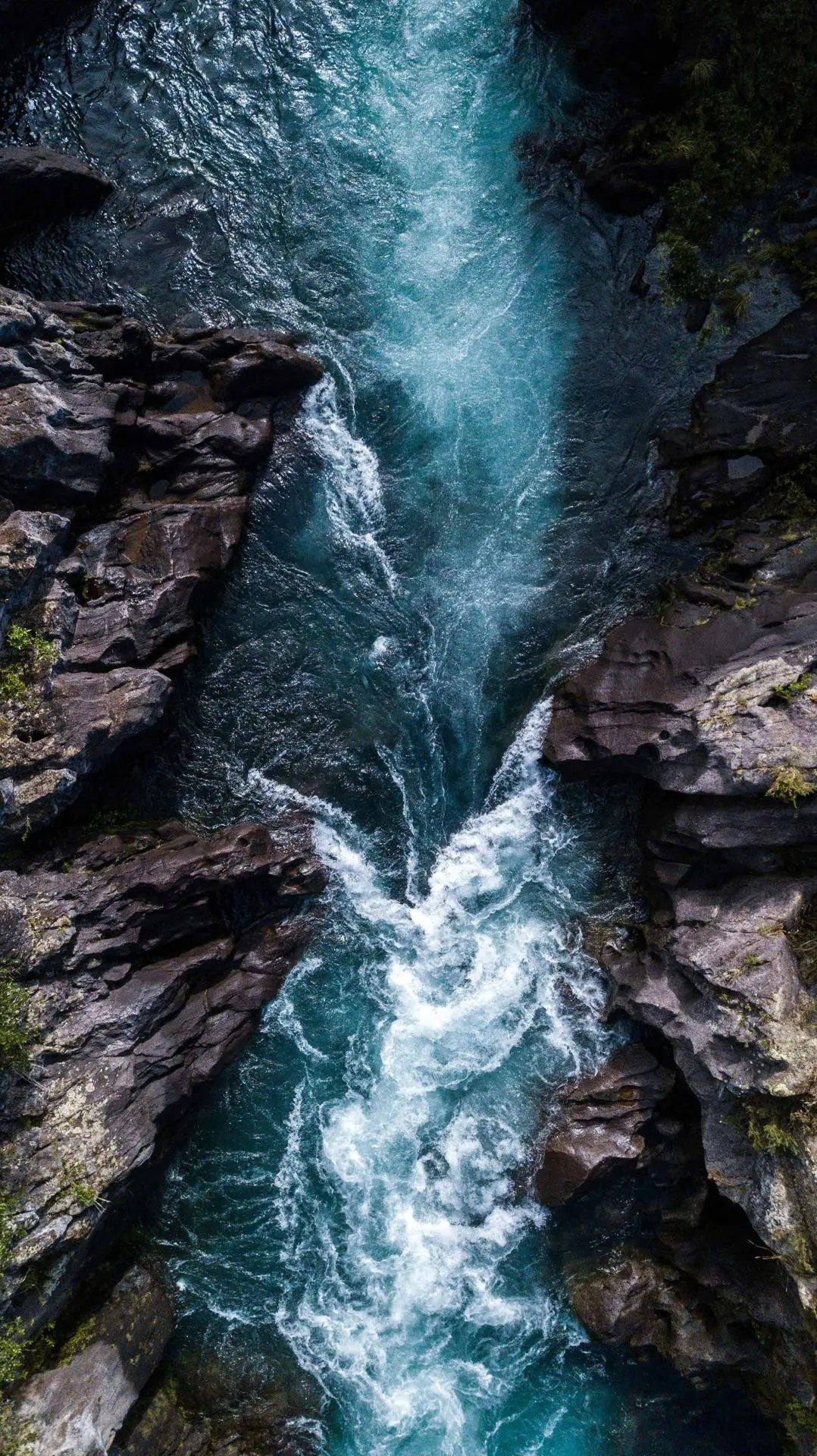 Waterfall running through a narrow rock canyon